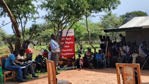 Legal officer from the Uganda Law Society sensitizing the community on the legal frameworks on FGM, Early child marriages, teenage pregnancies and all forms of violence during the legal aid clinic in Abiliyep Sub-County in Amudat District