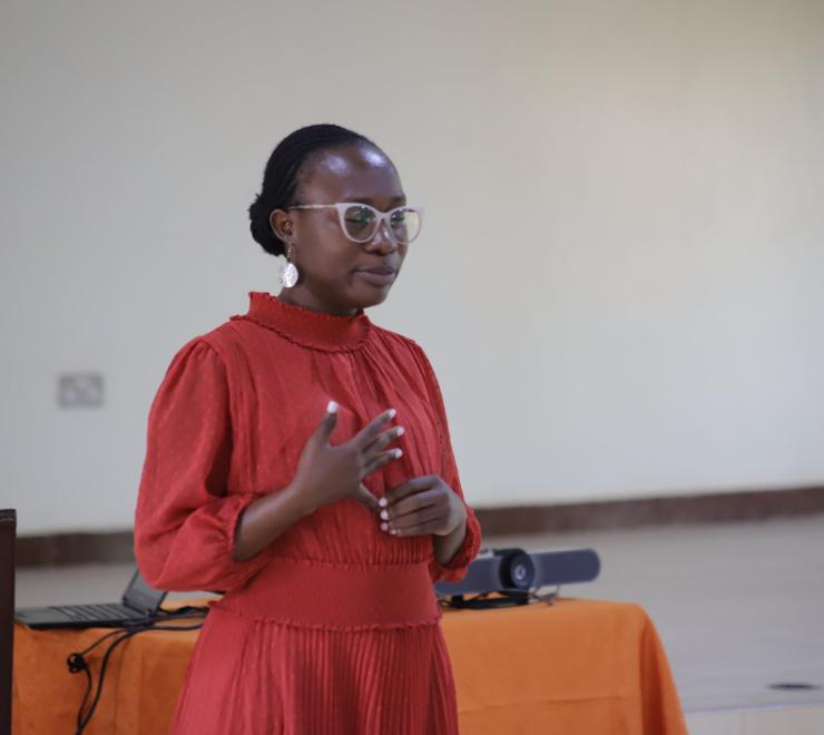 Ritah Nanyonga, the Project Coordinator for Africa Women Voices for Peace, Speaks to the women during the training