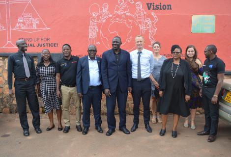 Amb Nicolaj A.Hejberg Peterson poses with Actionaid Uganda staff after a meeting 