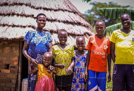 Akol and her family at their home