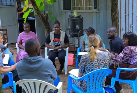 The AADK team interacts with staff in Mvepi Refugee Settlement