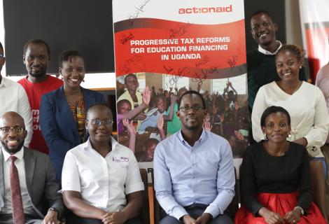 Participants take a group photo at the launch of the report