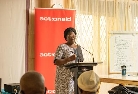 Honourable Betty Acan Aol, the Gulu Women Member of Parliament shares a light moment with district leader at the Integrity Forum