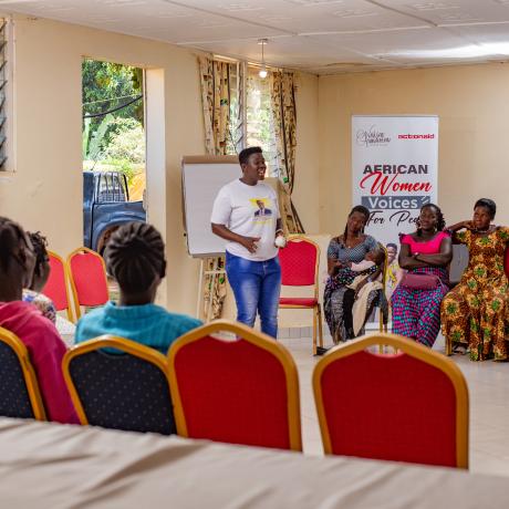 Stella shares her experience with the women during the training