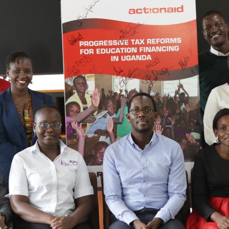 Participants take a group photo at the launch of the report