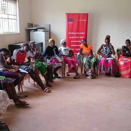 ActionAid legal officer, Christine Adokorach, speaks to community members during the feminist training