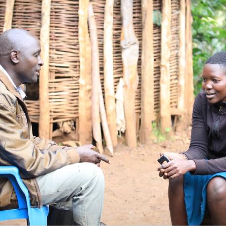 A male action group member counsels Evisha