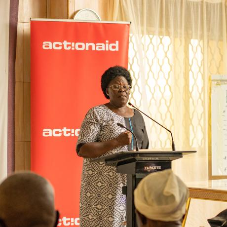Honourable Betty Acan Aol, the Gulu Women Member of Parliament shares a light moment with district leader at the Integrity Forum