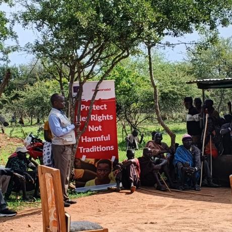 Legal officer from the Uganda Law Society sensitizing the community on the legal frameworks on FGM, Early child marriages, teenage pregnancies and all forms of violence during the legal aid clinic in Abiliyep Sub-County in Amudat District