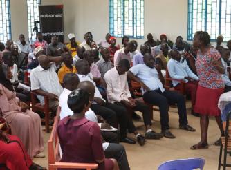 Esther Kisembo, the ActionAid Uganda FGG Coordinator, speaks to residents of Iganga during the land Awareness Week