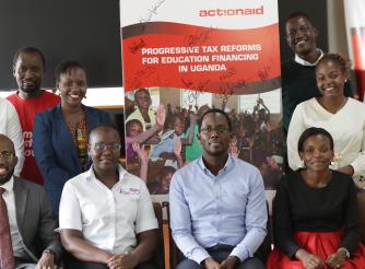 Participants take a group photo at the launch of the report
