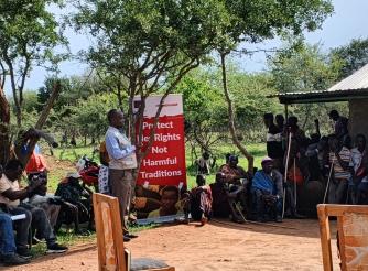 Legal officer from the Uganda Law Society sensitizing the community on the legal frameworks on FGM, Early child marriages, teenage pregnancies and all forms of violence during the legal aid clinic in Abiliyep Sub-County in Amudat District