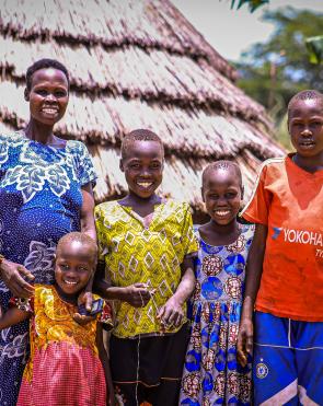 Akol and her family at their home